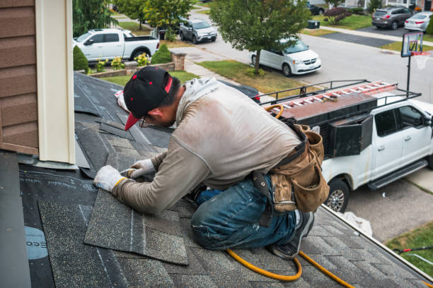 Professional Gutter Installation technician working in Newton, MA